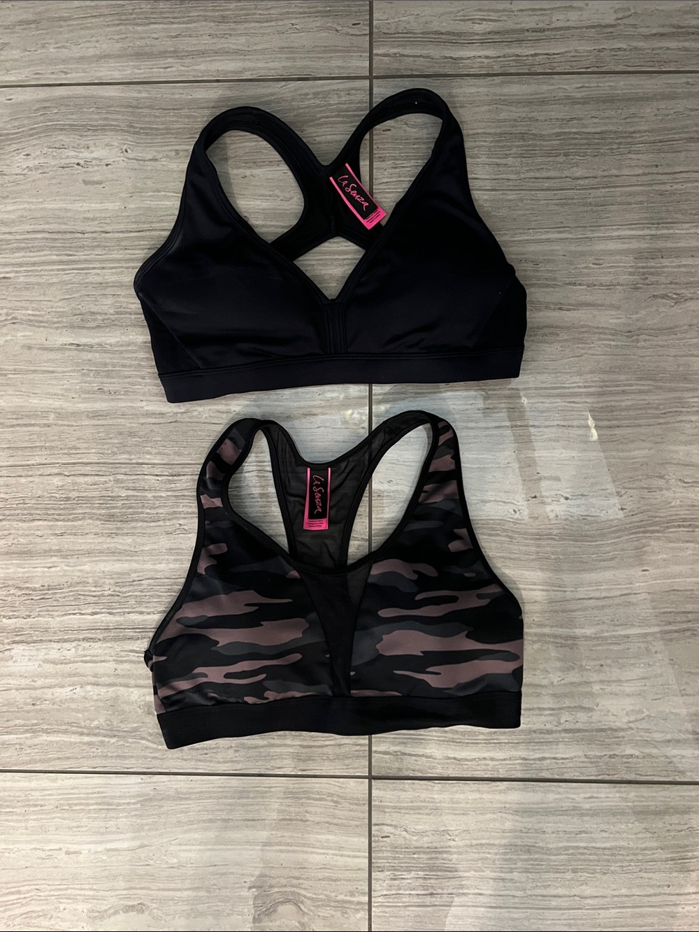 La senza sport bras both size medium. One black one camo